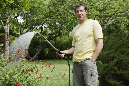 Gardener wearing PPE while operating lawn equipment